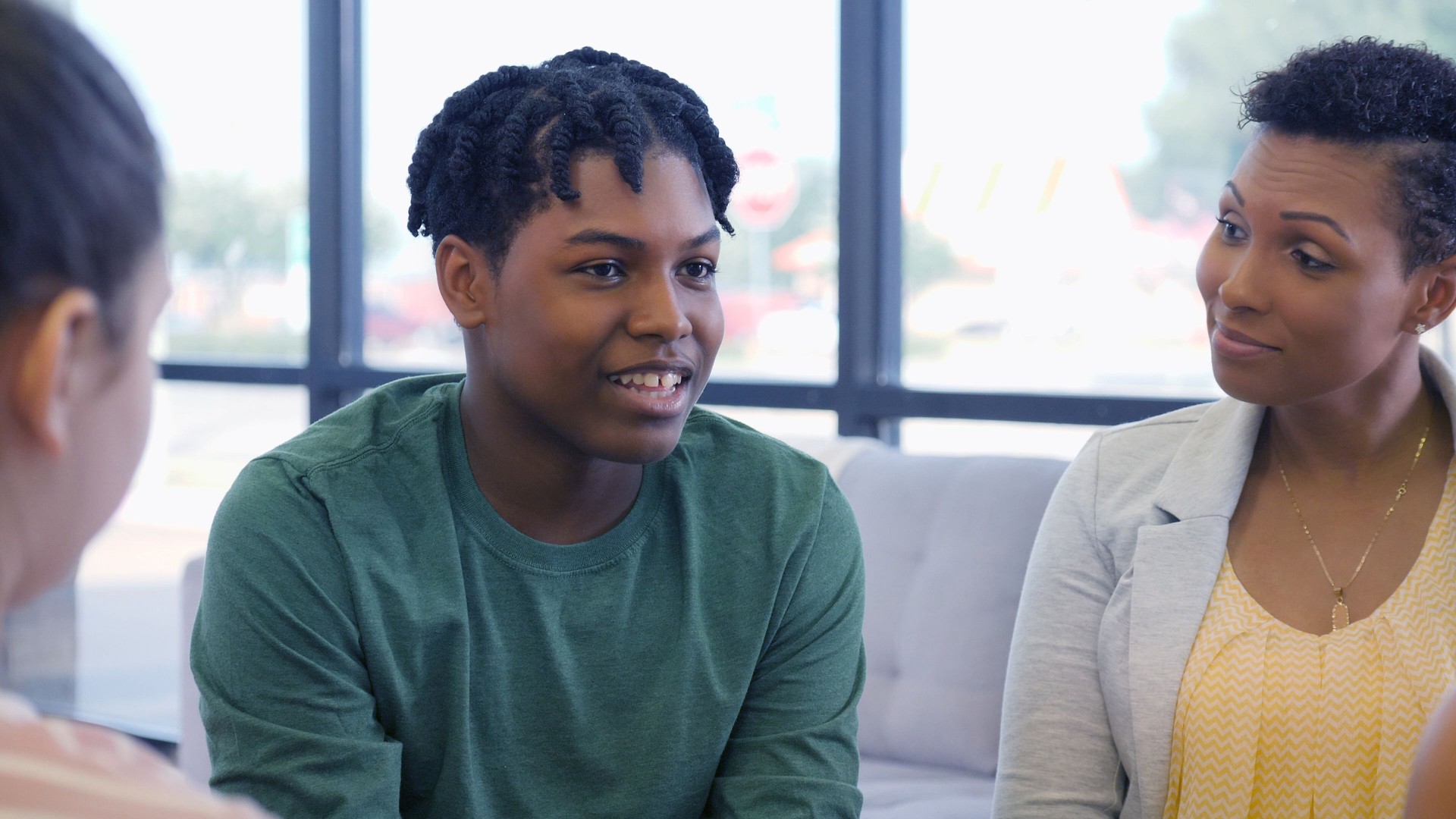 Teenage boy shares during group therapy session